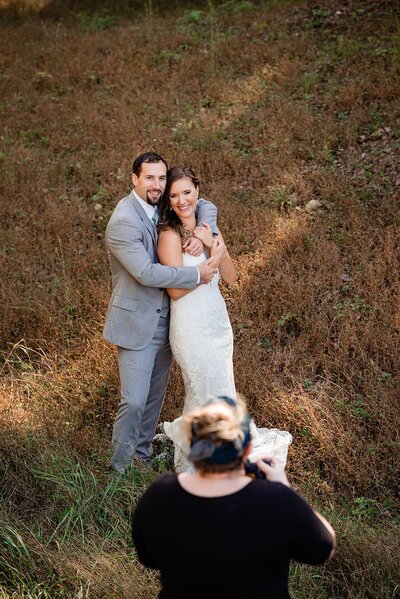 Mahlia taking photos of wedding couple