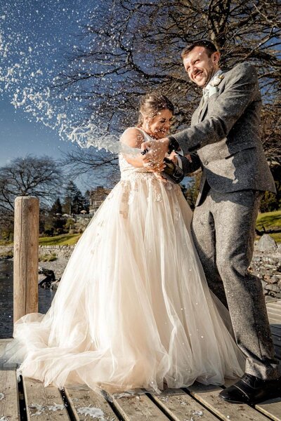 Bride with loose curls and jeweled hairpiece looking over her shoulder in soft natural light at Hazlewood Castel, captured by Yorkshire wedding photographer.