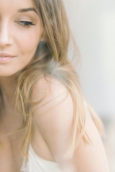 A sexy shot of a chin and a bare shoulder, during a Minneapolis Boudoir Session.