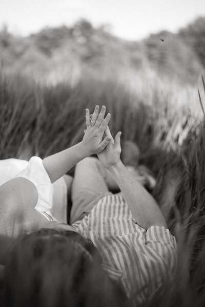 A striking black and white photo capturing two women walking towards each other, highlighting the elegance and timeless quality of their interaction with a classic, monochromatic touch.