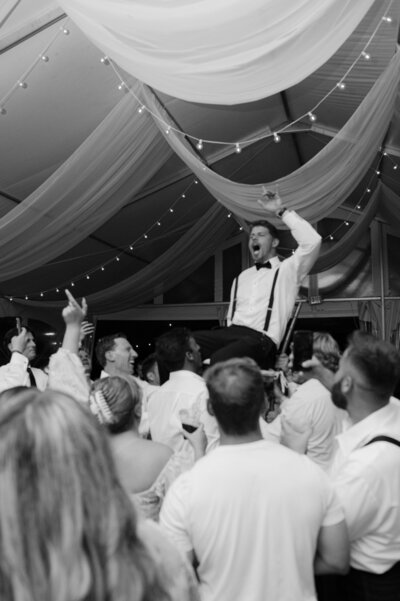 Upstate NY Wedding reception groom on top of shoulders yelling
