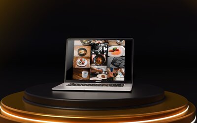 Laptop on a gold and black stage displaying a gallery of food photography and chef images.