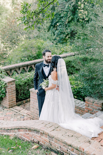 Atlanta Wedding Photographer | Bride And Groom Looking At Each Other At Garden Wedding Venue