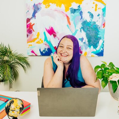 Wedding business and marketing strategist Heidi Thompson sitting at her desk
