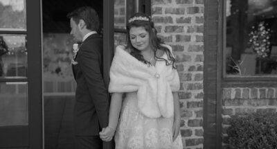 Bride and groom holding hands