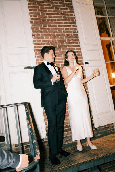 Bride on wedding guests shoulders during dance set at Glen Foerd Estate in Philadelphia, PA
