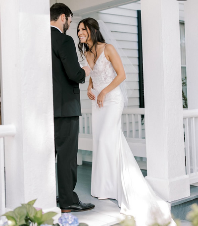 Bride and groom looking at each other while they share private vows.