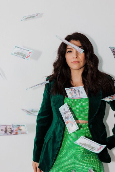 Samantha Piercy standing confidently with money falling