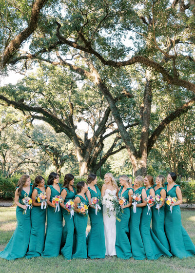 bride surrounded by bridesmaids