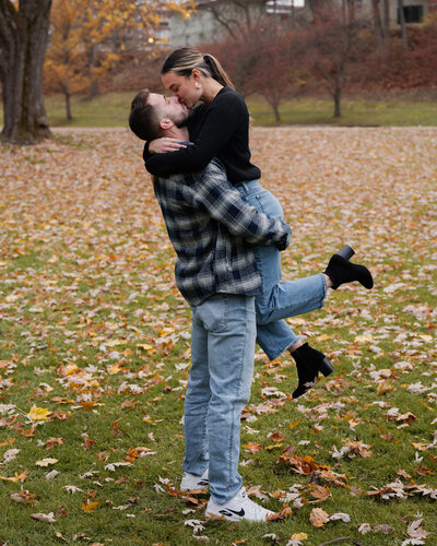 Celebrating their engagement during their proposal at Congress Park in Saratoga Springs, NY.