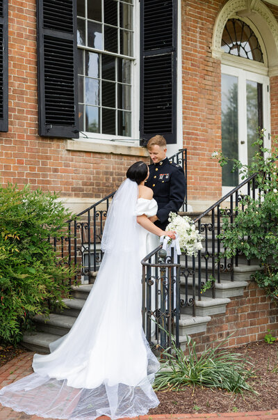 bride and groom posing on steps in Alexandria, VA