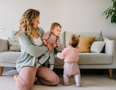 mother and daughter smiling on the couch