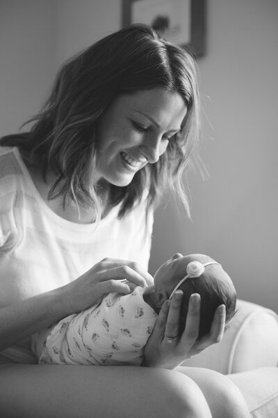 Woman smiling at baby