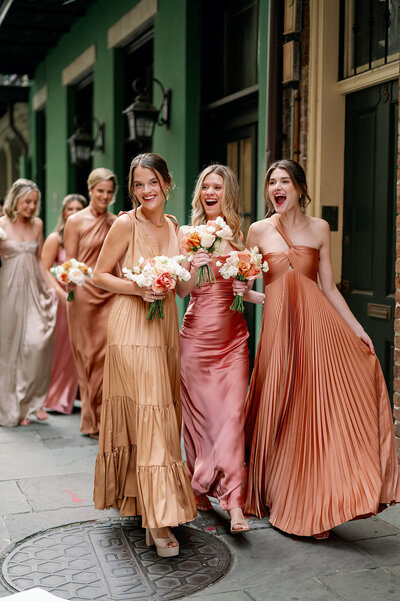 Bridesmaids walking and laughing