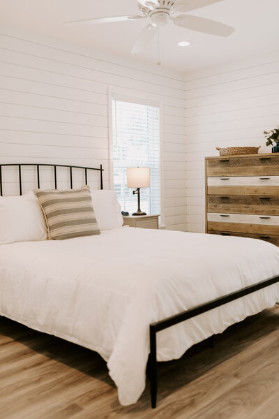 Bedroom with Queen bed in this three-bedroom, two-bathroom farmhouse in Castle Heights, just a few miles from Magnolia, Baylor, and the McLane Stadium in downtown Waco, TX.
