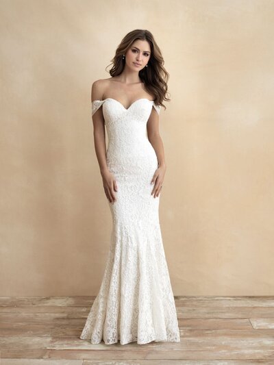 Unique sheet lace and a scalloped edge lend playfulness to this cap sleeved, A-line gown.