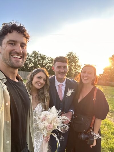 Amy & Nick posing with couple
