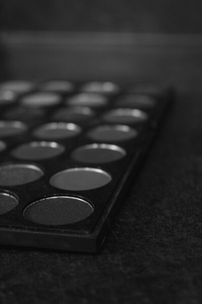 An open eyeshadow palette in black and white