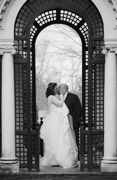 bride holding flowers in patio garden