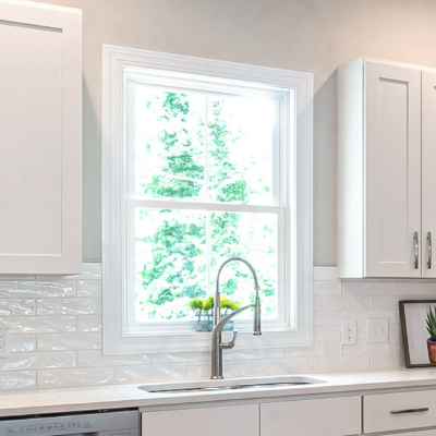 Traditional kitchen with a small double-hung window above the sink that allows you to open it up for fresh air flow and natural light while cooking.