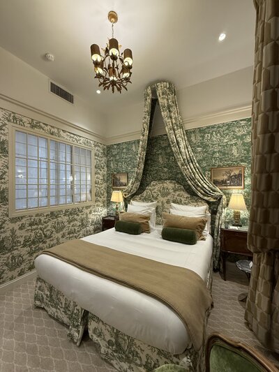 Luxury hotel bedroom with VIP perks - wine country travel accommodations