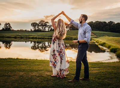 Couple Dancing by a pond at sunset