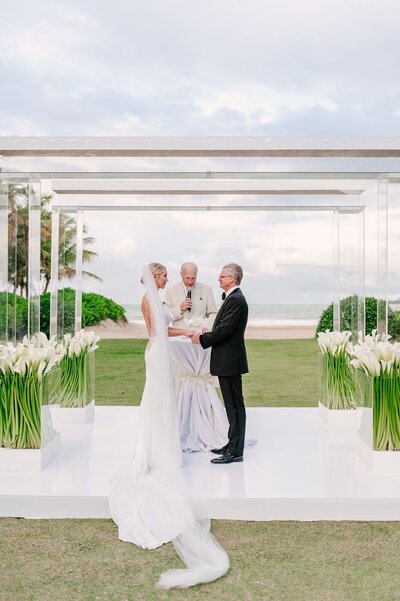 Destination wedding beach ceremony with modern decor