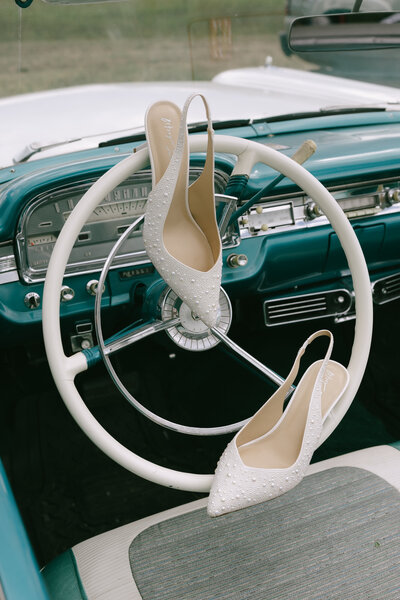 shoes-on-old-fashioned-steering-wheel