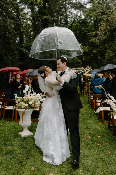 bride and groom in rain ceremony
