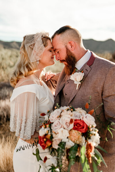 Saguaro National Park Elopement couple standing together with vintage wedding attire