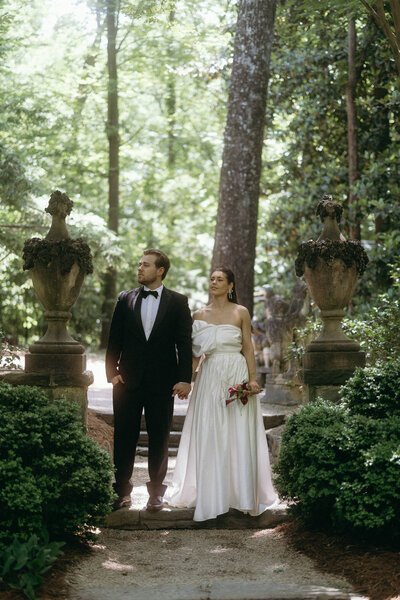 Couple embraces on their wedding day, surrounded by Tuscany’s serene beauty and charm.