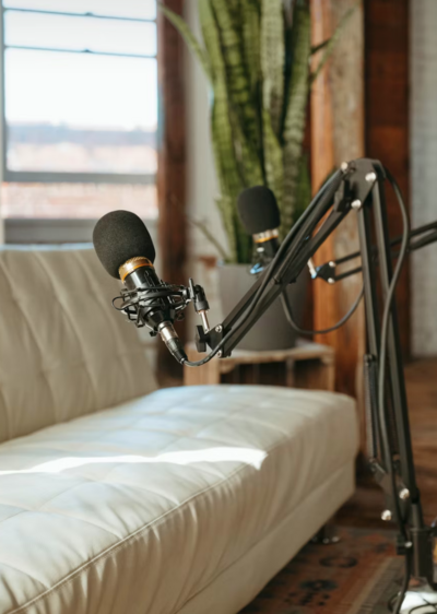 A minimalist podcast scene that captures the heart of the platform: creating space for voices to be heard, journeys to be shared, and purpose to unfold.

