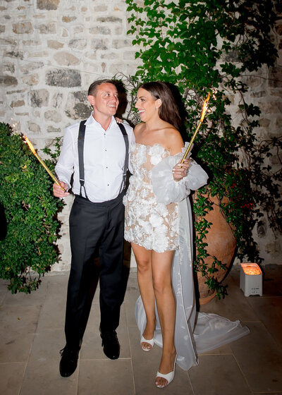 bride and groom facing each other and smiling. 