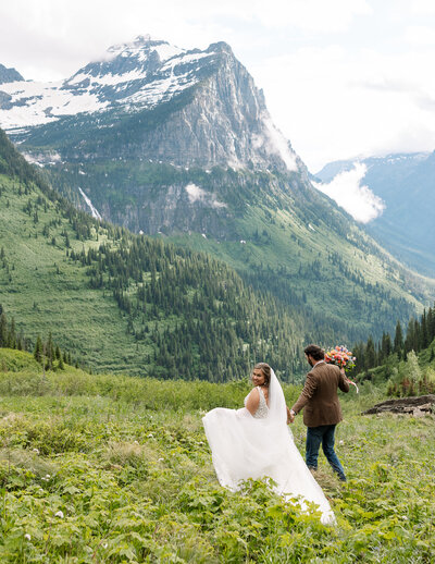 wedding photo in the mountains with bride and groom running — Madison Abernathy Photo