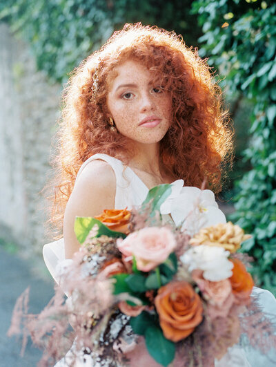 Ginger Haired Woman Holding  a Bouquet