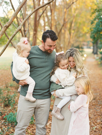 Family of 5 snuggles close for a Wake Forest NC family session. Image by Raleigh family photographer A.J. Dunlap Photography.