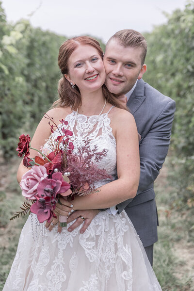 Detroit Michigan wedding couple smiling at the camera