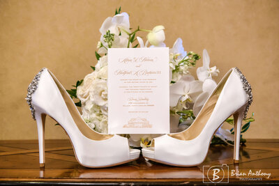 Luxury bridal heels paired with a beautifully designed wedding invitation for a high-end wedding.