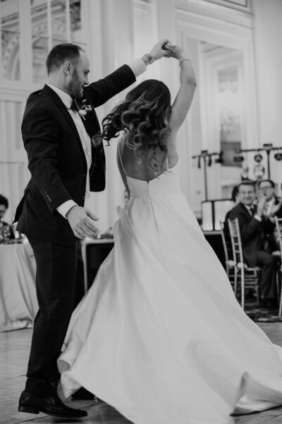 Groom spins bride in first dance