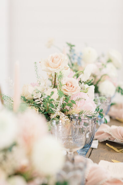 Lush floral centerpieces on wedding reception table