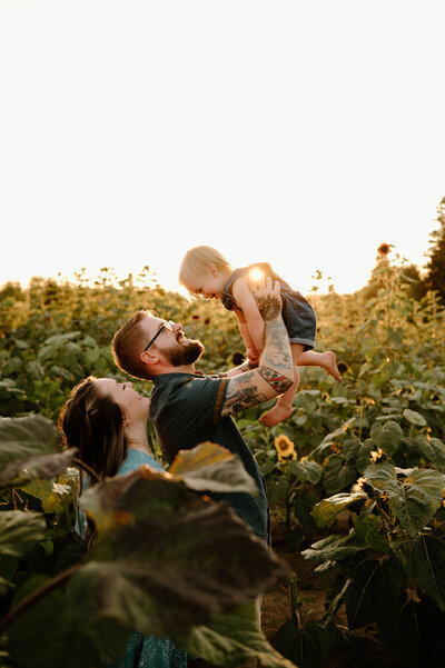 Family photos in sunflowers taken by Oregon family photographer Forgette Photo.