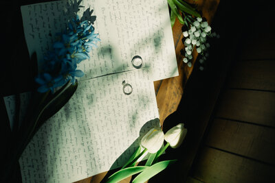 Wedding rings sit atop the hand written vows of a North Georgia couple.