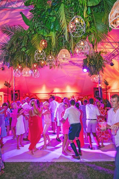Wedding reception dance floor with plant chandelier installation