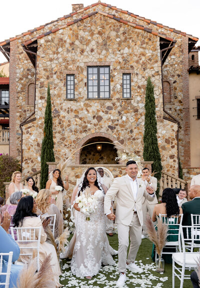 Bride and Groom Exiting Ceremony at Bella Collina in Montverde, FL