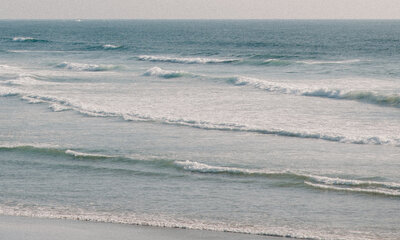 Close up of waves crashing into the shore on the oregon coast.