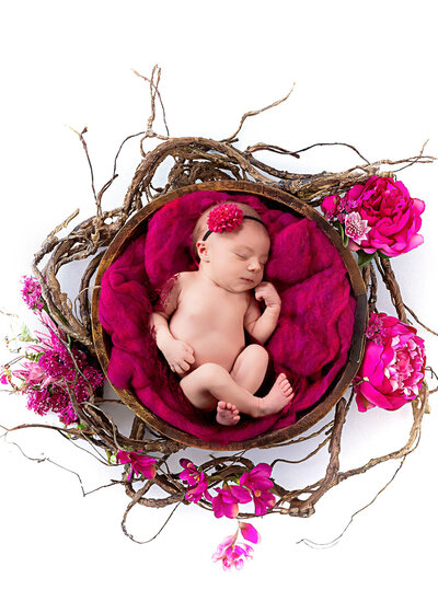 Beautiful floral wreath newborn photography session in Leawood, Kansas. A favorite for parents exploring Kansas City baby photographers and daycare options.