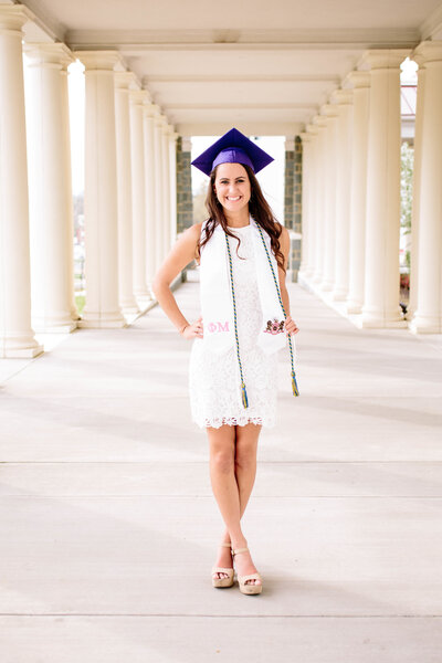 Senior in cap and cords at James Madison University campus