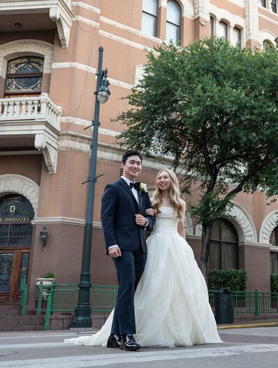 Bride and groom walking downtown in Austin, Texas after wedding ceremony