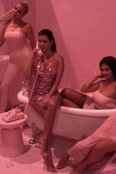 Group of girls glammed up for a photoshoot in a battub