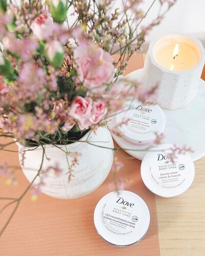 Dove Body Love Beauty Cream travel-size set of four 2.53oz jars, perfect for hydrating face and body while traveling in fall.